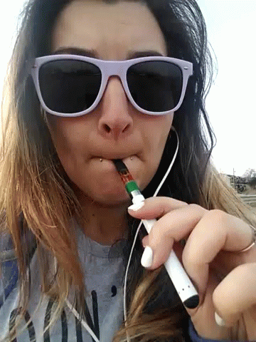 Vaping girl plays with