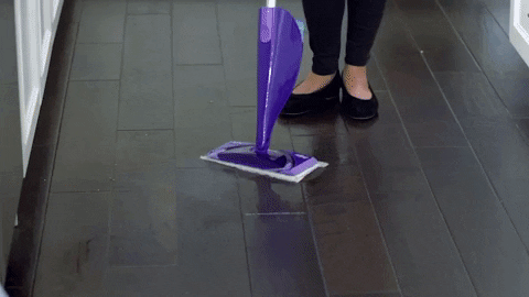 Cleanin lady washing floor