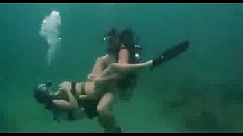Sexy asian scuba diving underwater